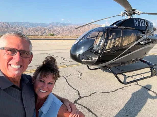 A Bell 222SP helicopter crash site in Huntington Beach, California, with firefighters and police securing the area — CF Posts news photo.